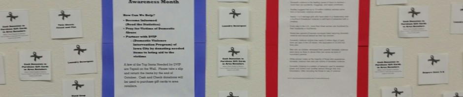 Bulletin board with October movie schedule and weekly movie quotes.