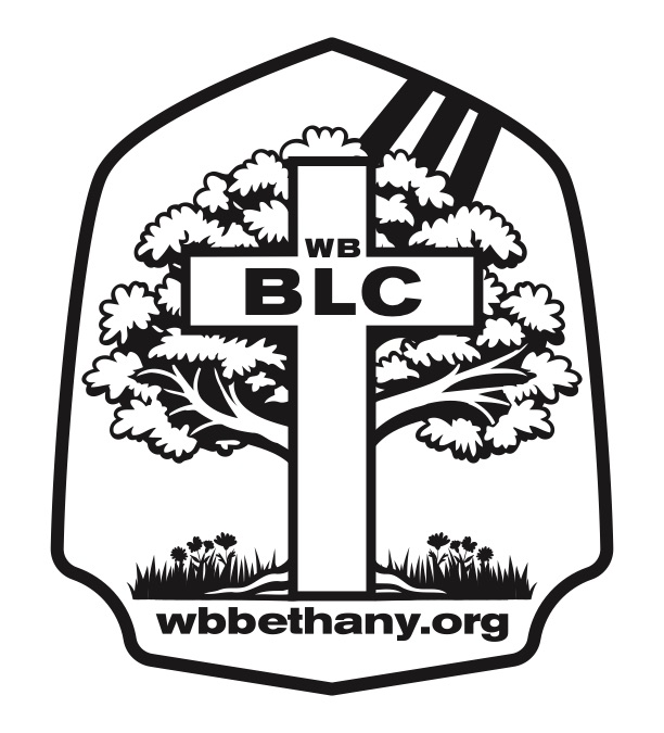 Group of people making a star shape with their fingers outdoors.